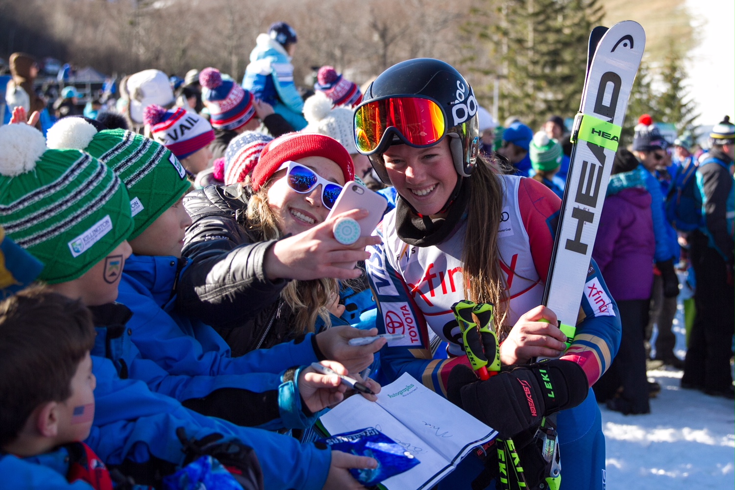 Skier AJ Hurt taking a selfie with a fan